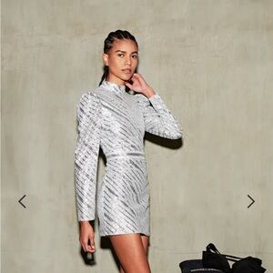 Platinum sequins dress, never worn .Pearl buttons, back of neck. back zipper.